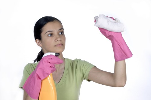 Skilled cleaners removing construction dust